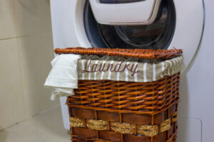 Laundry,Basket,That,Says,'laundy',On,It,,In,Front,Of